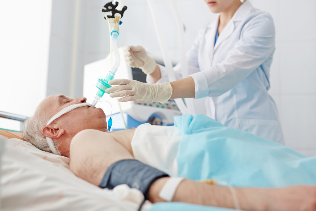 Senior patient receiving respiratory care at a critical illness recovery center.