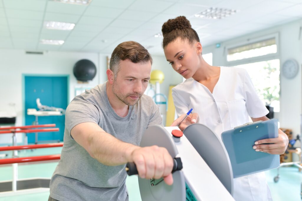 Man using physical therapy machine